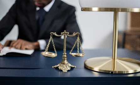 Legal scales of justice representing Kima & Partners